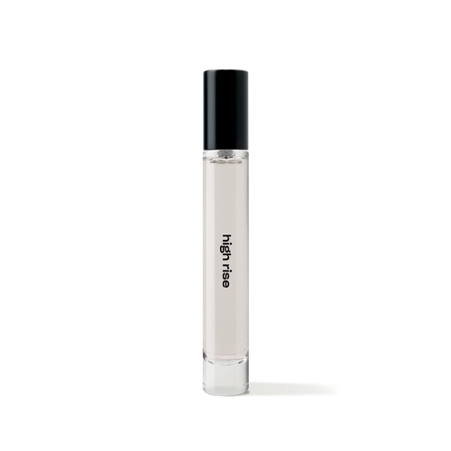 REF High Rise 10ml travel-size eau de parfum bottle, minimalist glass design with black cap.