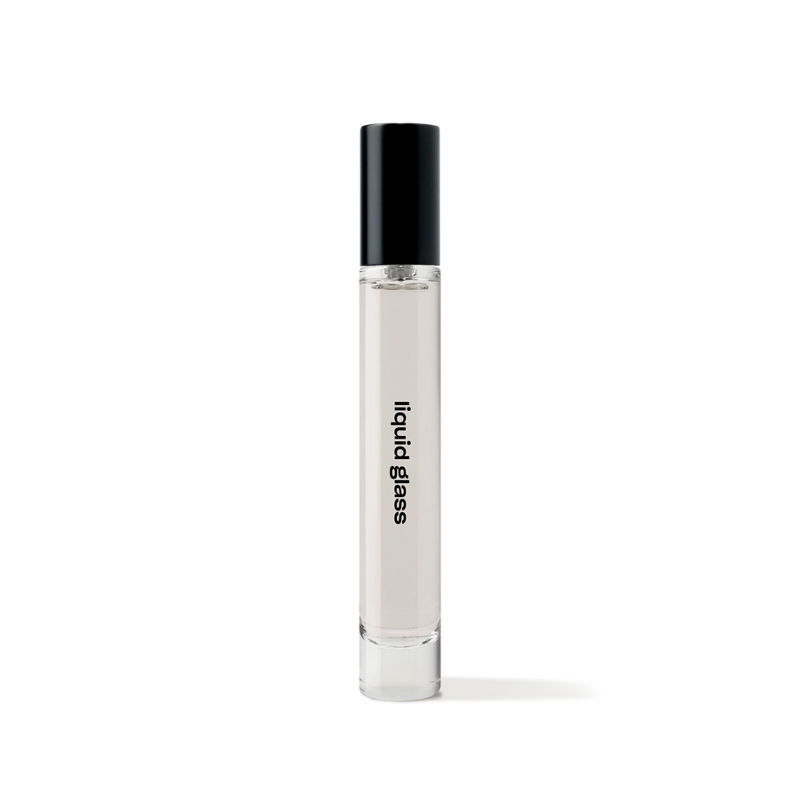 REF Liquid Glass 10ml travel-size eau de parfum bottle, minimalist glass design with black cap.